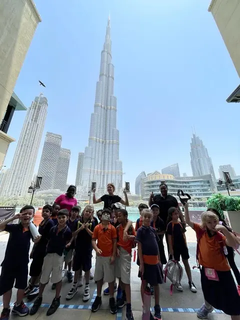 Students on the Downtown Dubai art and architecture field trip with Dubai by Foot exploring Burj Plaza and the Dubai Opera